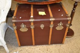 A vintage wooden bound steamer trunk