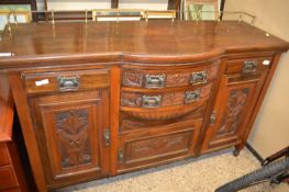Late Victorian American walnut bow front sideboard with carved decoration