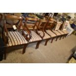 A set of eight reproduction mahogany dining chairs with brass inlay decoration