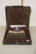 A cased Corona typewriter