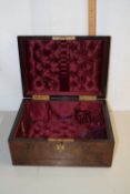 A Victorian burr walnut veneered former vanity case with fabric lined interior