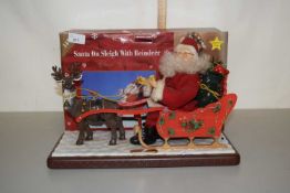 A Santa on Sleigh with Reindeer Christmas ornament