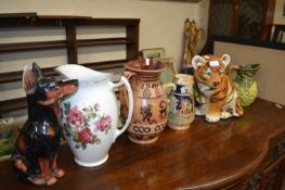 Mixed Lot: Ceramics to include a tiger cub, a small dog and various jugs