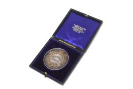 Silver cased Norfolk Agricultural Association Breeders Medal in purple silk and felt lined leather