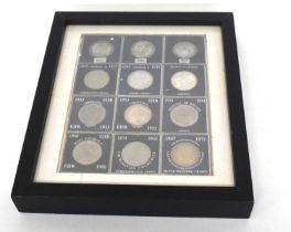 Collection of twelve British crowns including 1821, 1890, 1895 in black frame