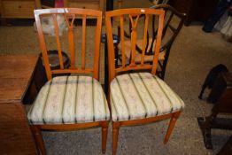 Pair of modern dining chairs with striped upholstered seats