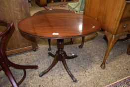 An oval topped reproduction mahogany wine table