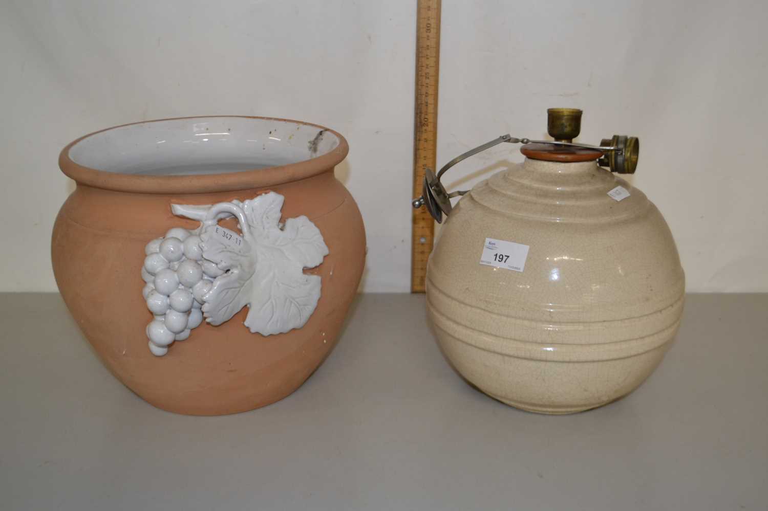 A French pottery table lamp and a further terracotta jar