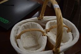 A wicker basket and two smaller examples