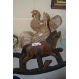 A pair of modern carved wooden models of chickens and a further rocking horse model (3)