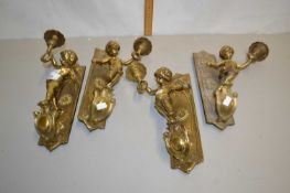Group of four brass wall mounted figural table lamps