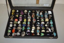 A display case with various costume jewellery, rings etc