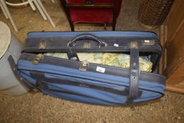A suitcase of floral curtains