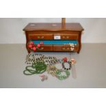 Small table top cabinet containing various assorted costume jewellery