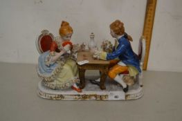 A continental porcelain model of a couple playing cards