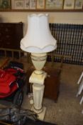 A modern table lamp and matching pedestal stand