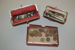 A collection of British and World coinage in two purses and a box, mainly circulated grade