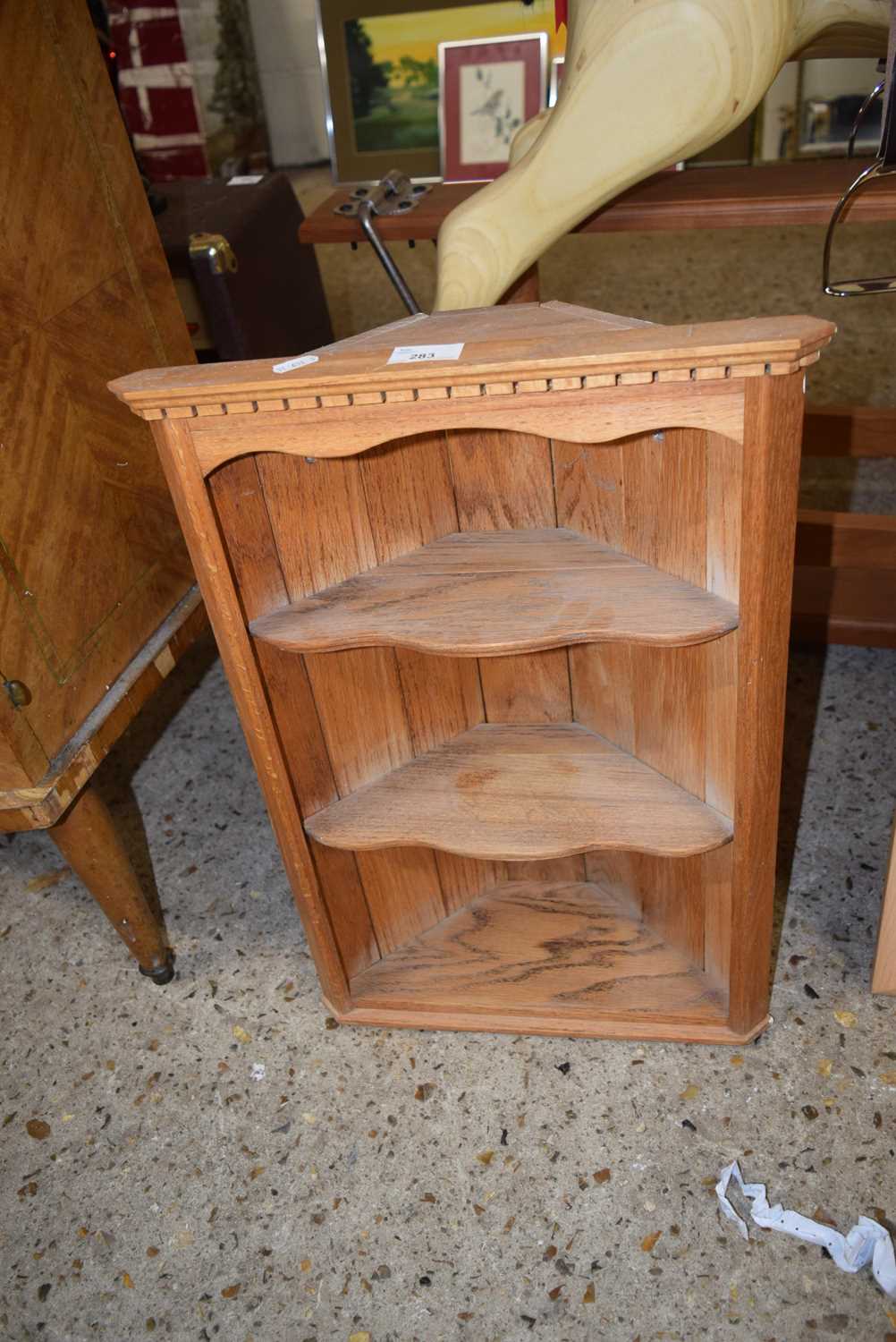 A pine wall mounted corner cupboard