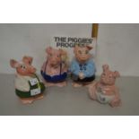 Four Nat West Wade piggy banks