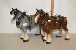 A pair of porcelain model Shire horses