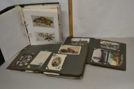 A group of three albums of various postcards and greetings cards