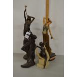 A group of four various modern composition figurines