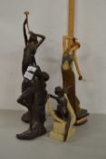 A group of four various modern composition figurines