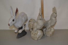 Mixed Lot: Pair of pottery cockerels and a further pottery hare (3)