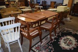 A MacIntosh twin pedestal dining table and six chairs