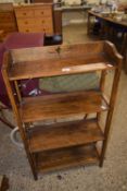 An early 20th Century oak four tier bookcase cabinet