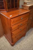 A pine four drawer chest of drawers
