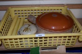 A terracotta cooking pot, a stone ware storage jar and four faux candles