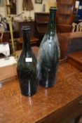 Two large glass bottles