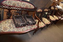 A seven piece Edwardian salon set comprising two seater sofa, four chairs and two footstools