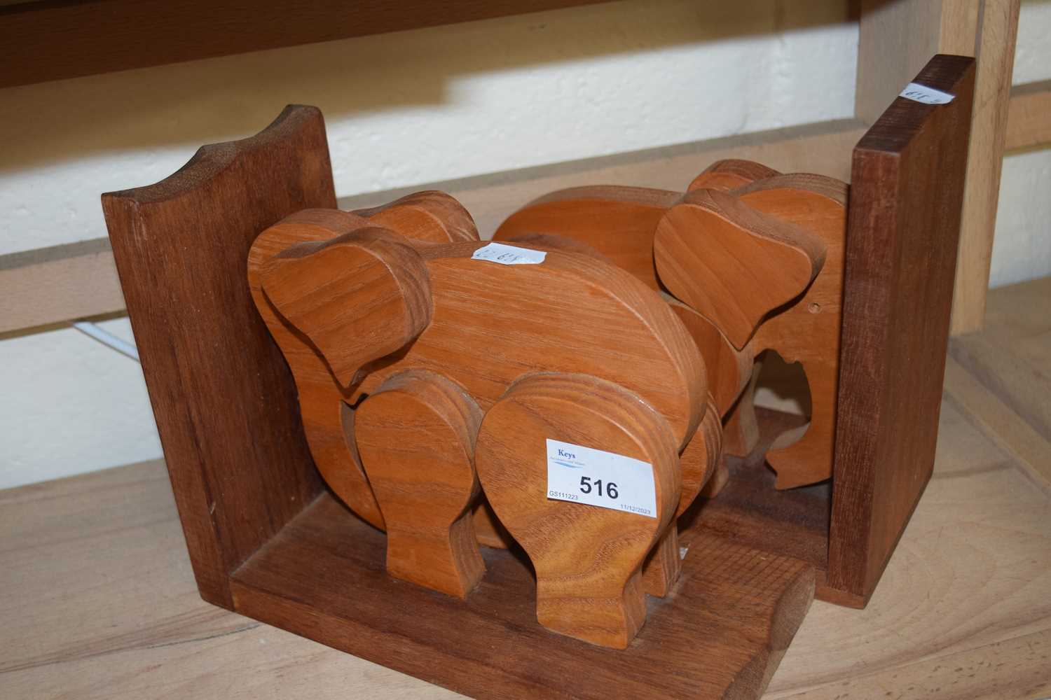 A pair of wooden elephant book ends