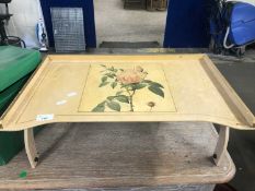 A floral painted lap tray