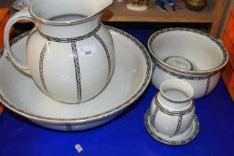 An early 20th Century black and white decorated wash bowl, jug set
