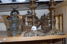 A Walker & Hall three piece EPNS tea set together with a pair of electroplated candlesticks and a