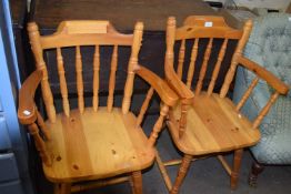 A pair of pine kitchen chairs