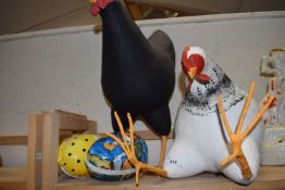 Two large papier mache models of chickens and two Easter eggs