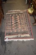 Two pink ground rugs