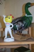 An Esso figure and a model of a metal duck