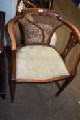 A cane backed elbow chair