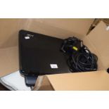 An Acer laptop and two Toshiba laptops with chargers