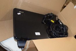 An Acer laptop and two Toshiba laptops with chargers