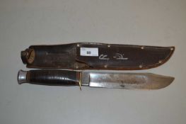 William Rogers bowie type knife in leather sheath