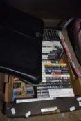 Box of various Playstation games, a Wii balance board etc
