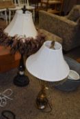 Two modern table lamps, one with a floral decorated shade