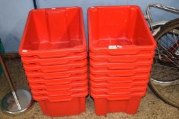 Quantity of red plastic stacking boxes