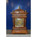 An early 20th Century continental Winterhalder and Hoffmeier mantel clock set in an architectural